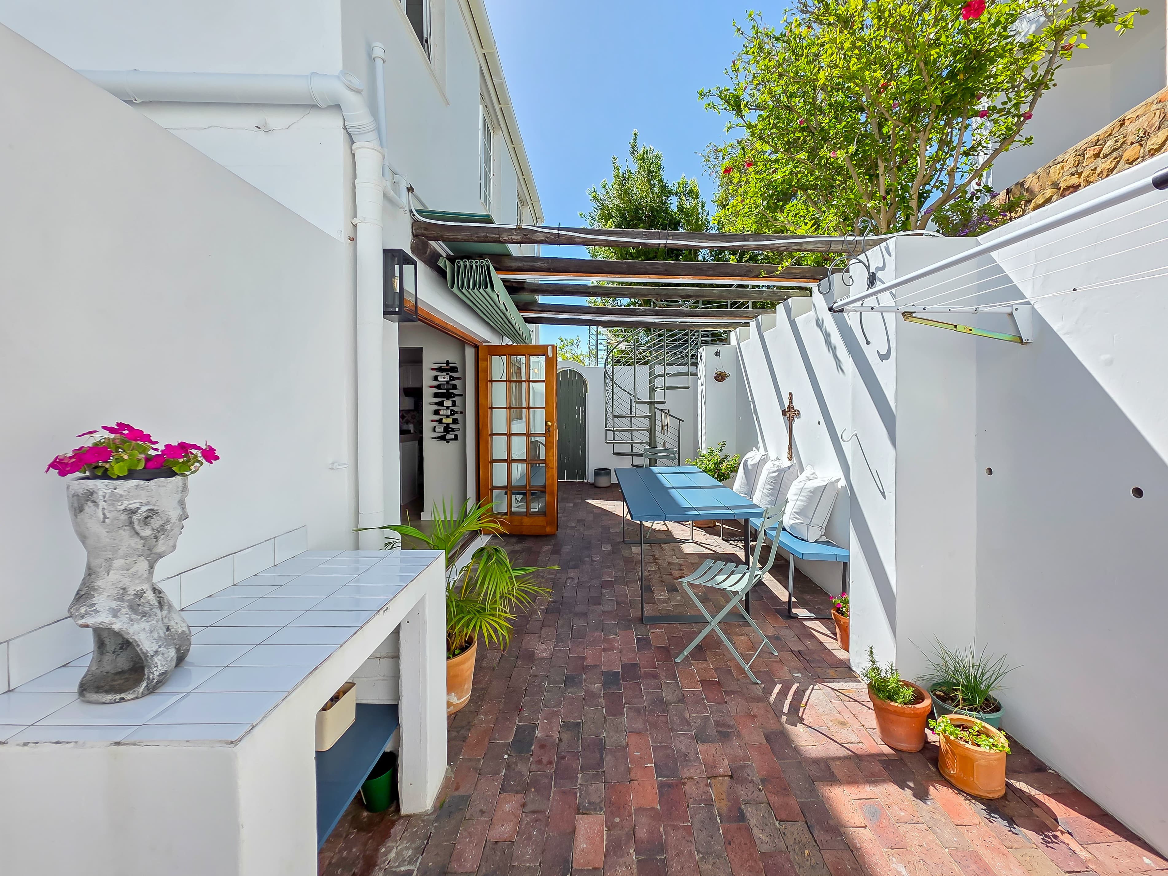 The outdoor area below the terraced garden and hammock.
